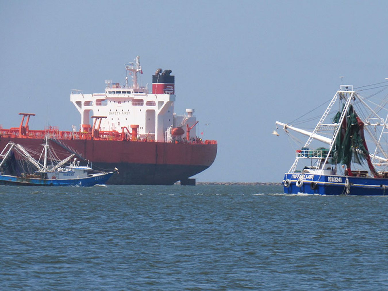Shrimp Boats and Ship on Bolivar Roads
